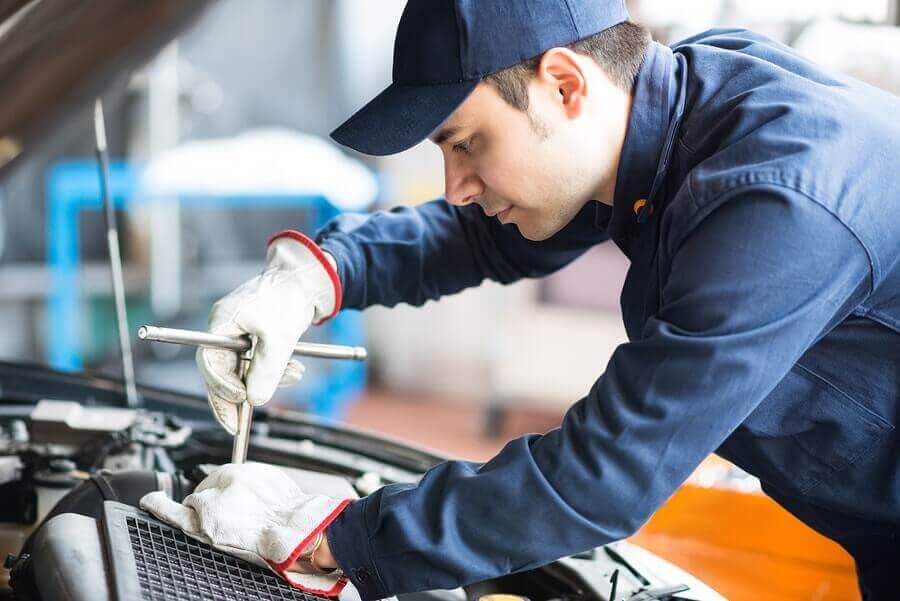 A mechanic working on a car